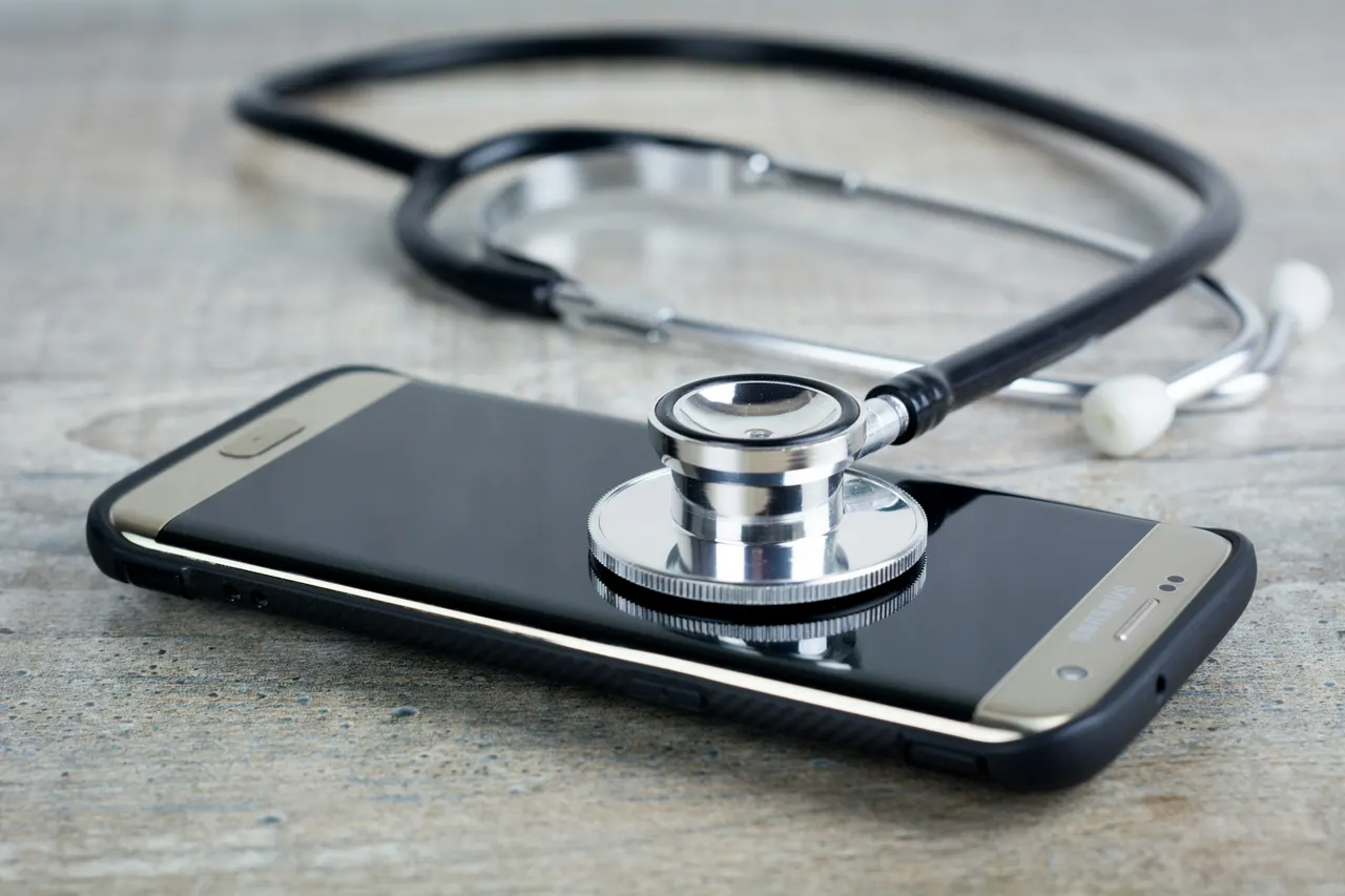 Smartphone with a stethoscope resting on it