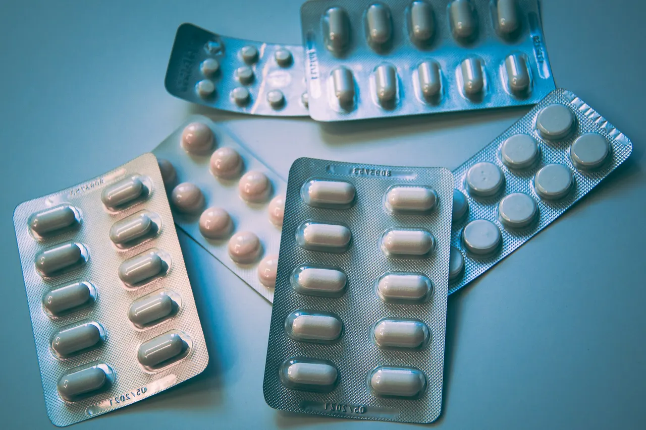 Blister packs of white and blue pills